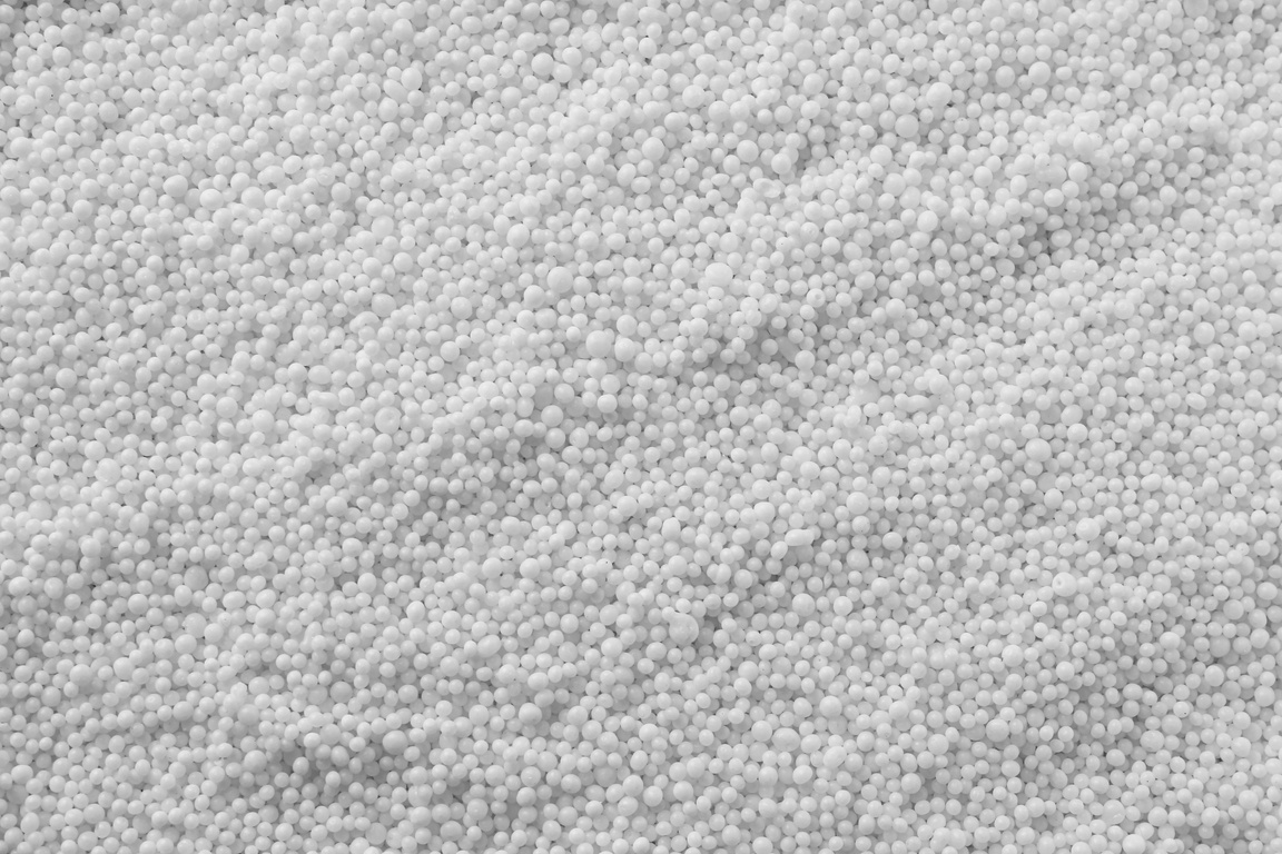 Pellets of Ammonium Nitrate as Background, Top View. Mineral Fer